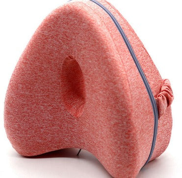 Pink neck pillow with a textured surface on a white background